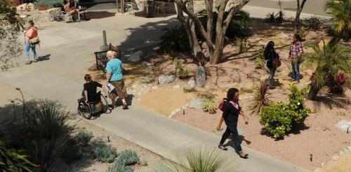 several students walk across scott courtyard in different directions